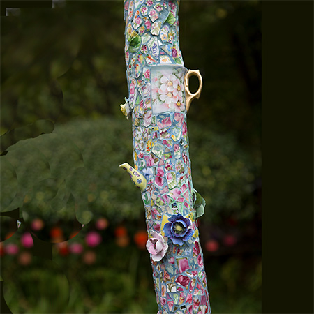 Unusual tall garden sculptures made from broken ceramics, shells and shale